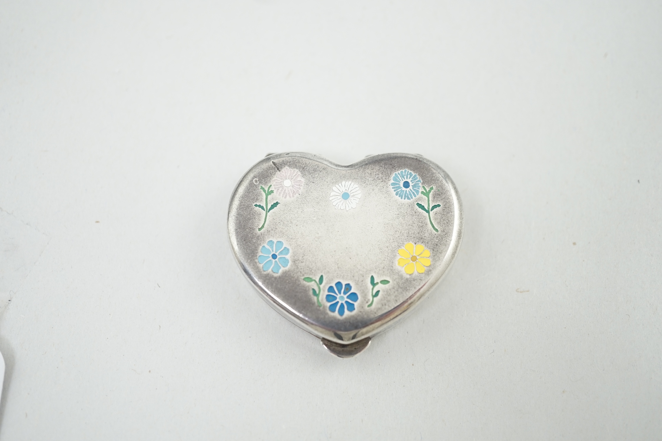 A modern Cartier sterling silver and polychrome enamel heart shaped pill box